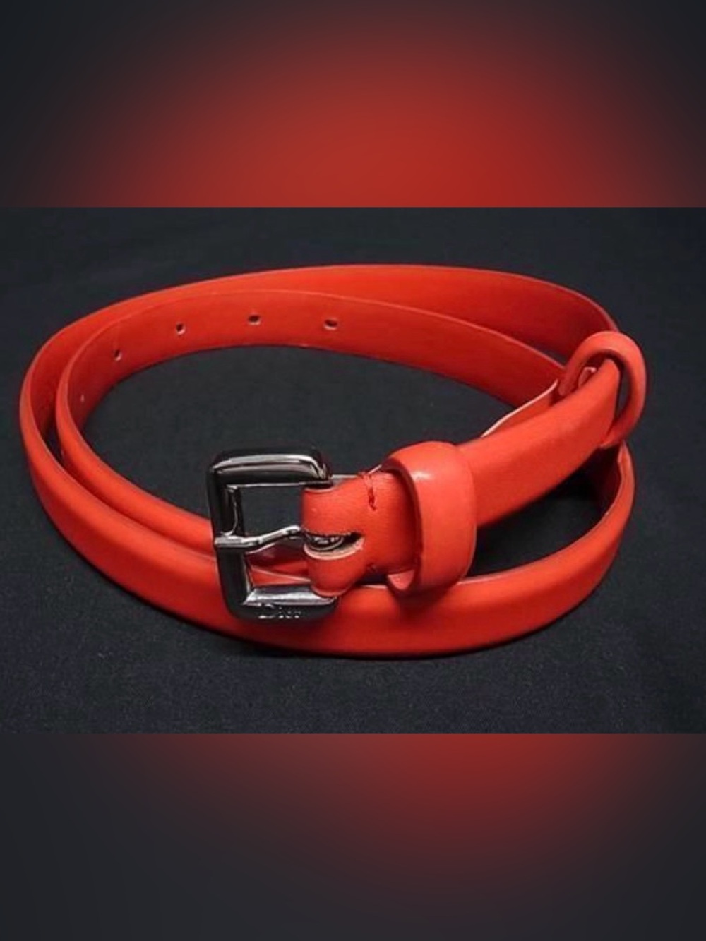 Christian Dior vibrant red leather w/ silver tone pin buckle. EUC 26-29”